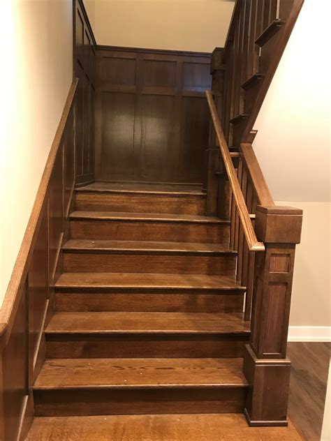 Craftsman Style Staircase With Wood Balusters And Wainscot Panels