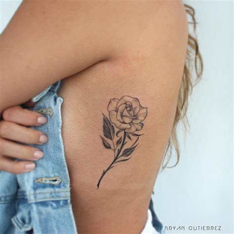 Rib tattoos can only be seen by the public if the person wearing it wants it seen. Rose tattoo on the rib cage by Bryan Gutierrez ...