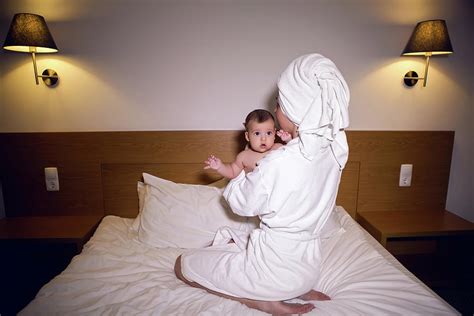 Mother In A Bathrobe Lying On Bed Photograph By Elena Saulich Fine Art America