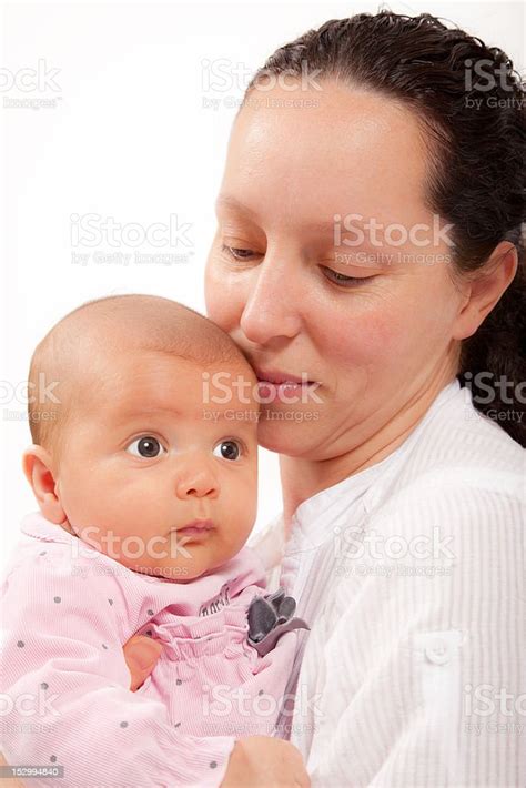 Happy Mother Holding Her Cute Two Months Daughter Stock Photo