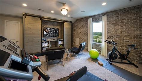 Industrial Man Cave And Exercise Room With Exposed Brick