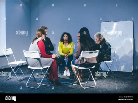 Large Group Of People Having A Counseling Session Stock Photo Alamy