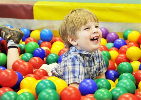 Happy Kid Playing With Colored Balls Stock Image Image Of Happy Face