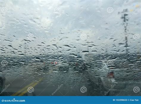 Rain Drop On The Car Glass Backgroundroad View Through Car Window With