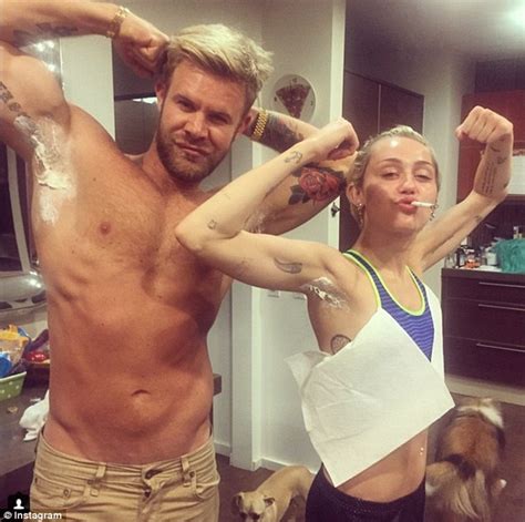 Miley Cyrus Strips Down To Show Off Her Bright Pink Arm Pit Hair On