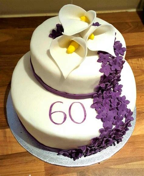 Come see our unique birthday and holiday gift ideas. 60th birthday cake Lillies and small purple flowers | 60th birthday cakes, Cake, Birthday cake