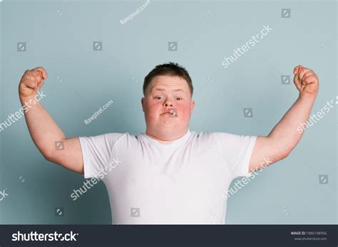Proud Boy Down Syndrome Flexing His Stock Photo 1986198956 Shutterstock