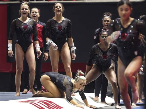 the red rocks cheer on kim tessen as she performs in the vault during the arizona state and