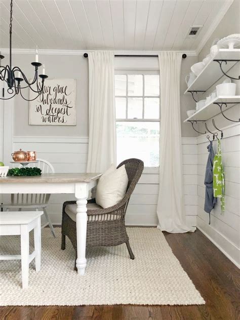 A space to study and rest. Farmhouse dining room rug, hardwood floors, walls shelves ...