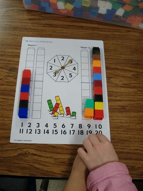 Using just dice, dominoes, and a flower mat, your kindergarten and first graders will get lots of practice identifying combinations that total sums of 2 through 12. Beat You to 20. No download, just picture for inspiration ...