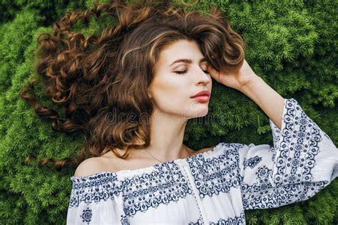 Woman With Long Curly Hair Lying On Spring Grass Stock Image Image Of