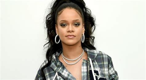 American Singer Rihanna Strikes Sexy Pose In New Bodysuit Outfit