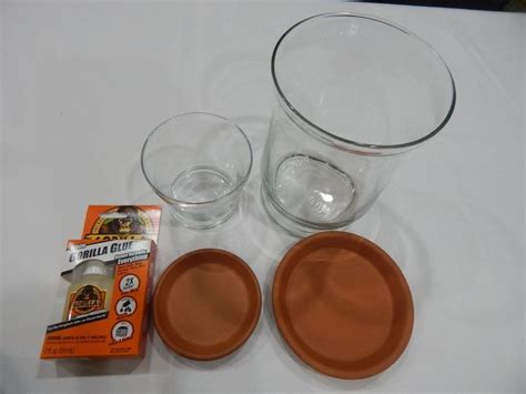 Gorilla super glue white spray paint gold spray paint painter's tape 3 round glass vases (two small and one large). DIY Bathroom Canisters and Jewelry Holder Set | Hometalk