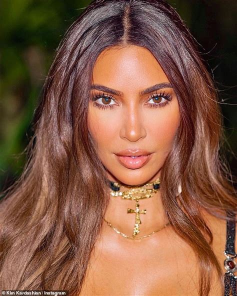 kim kardashian shows her frame in a sexy swimsuit and goes topless to promote new fragrance
