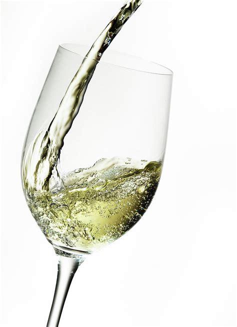 White Wine Pouring Into A Glass By Ts Photography