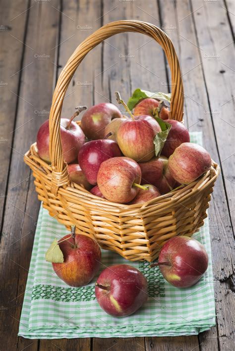 Basket With Apples On A Wooden Table Containing Apple Basket And