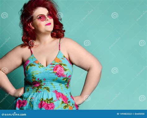 Pretty Plus Size Fat Woman With Enigmatic Mysterious Face Looks At Us Like She Suspects Us Of