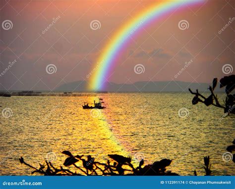 Blur Boat In Sea Sunset Rainbow Sky Reflection Rainbow On Water Stock