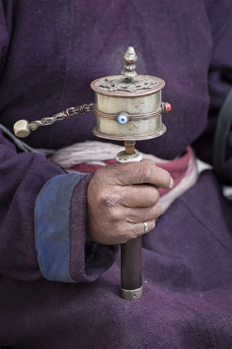 Old Tibetan Man Holding Buddhist Prayer Wheel Ladakh India Stock