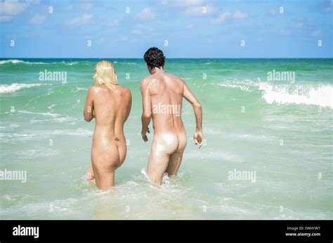 Two Adults Are Playing Naked In A Nude Beach Stock Photo Alamy