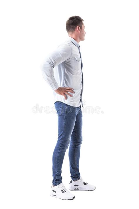 Young Stylish Business Man With Hands On Hips Looking Away Side View