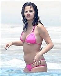 Selena Gomez Stuffs Her Fat Ass Into A Bikini