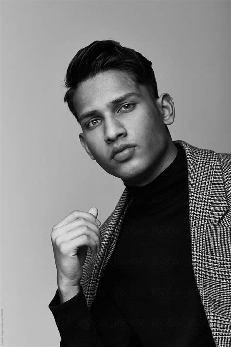 Handsome Indian Guy Portrait Wearing Turtle Neck And Coat On Black And