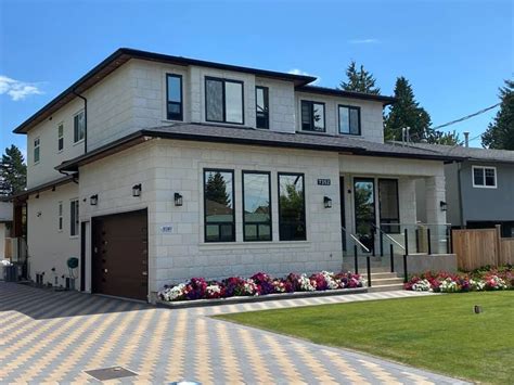 Black and white house exterior with stone. White Stone Siding in 2020 | Stone siding, House styles ...