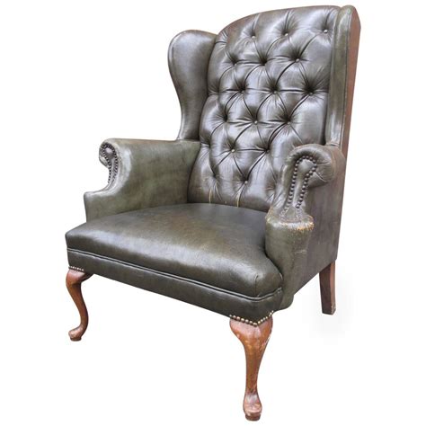 Chesterfield queen anne high back wing chair with footstool handmade in england & upholstered in vintage tan leather each of these beautiful queen anne chairs and footstools are carefully. Queen Anne Tufted Leather Wingback Chair For Sale at 1stdibs