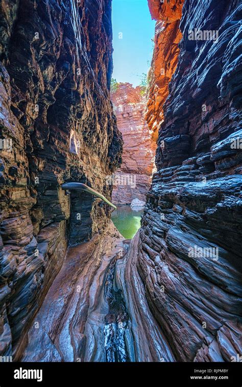 hiking to handrail pool in the weano gorge in karijini national park western australia stock