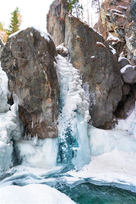 Frozen Waterfall In The Bed Of The Kyngyrga Mountain River In Early