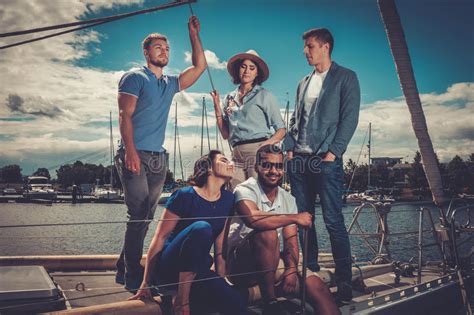 Happy Friends Eating Fruits And Drinking On A Yacht Stock Image Image