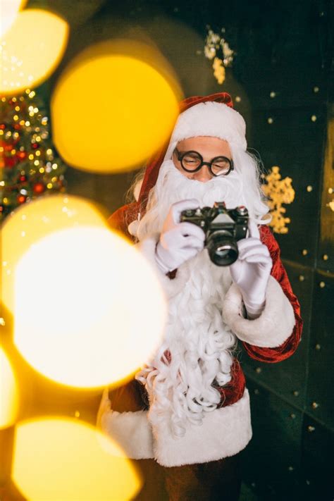 Santa Claus Making Photos On Camera Photo Free Download