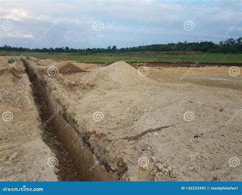 Deep Trench Cut In The Dirt At Construction Site Stock Photo Image Of