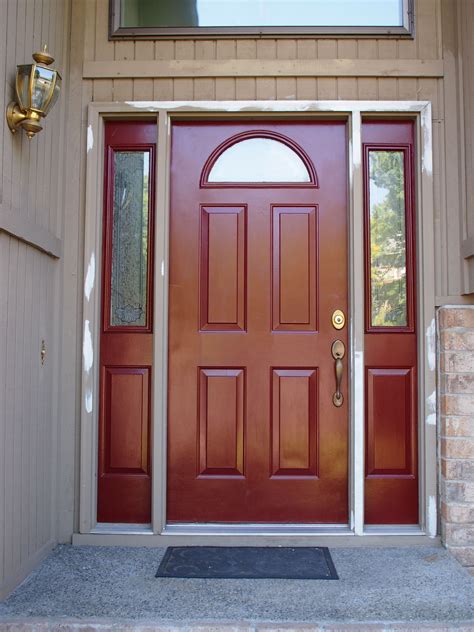 A Red Front Door With Two Sidelights