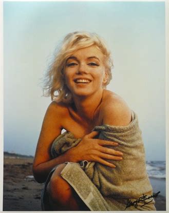 A Stunning Photograph Of Marilyn Monroe Taken At The Beach On A Summer Day In By