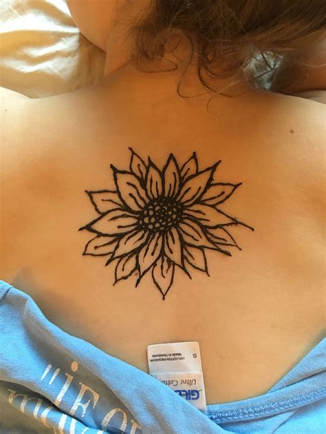 Statement circular motif with abstract toes. Back henna sunflower flower easy summer tattoo | Flower ...