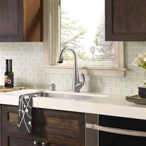 Rather than serving as a focal point, this backsplash simply contributes to the sleek, elegant look of the room. Pin by Julie on Kitchens | Pinterest | Backsplash with ...