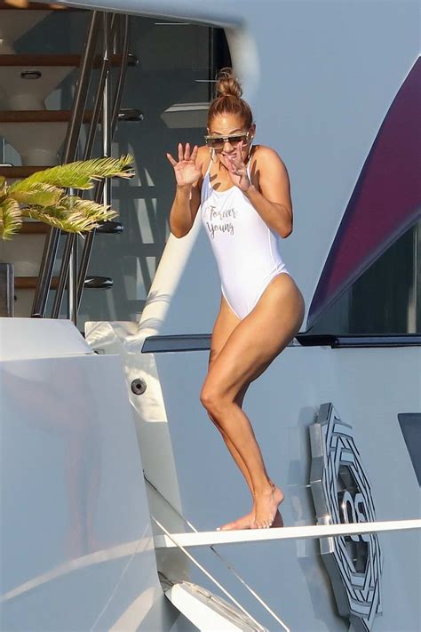 Jennifer Lopez Poses In A White Swimsuit During A Photoshoot On Her