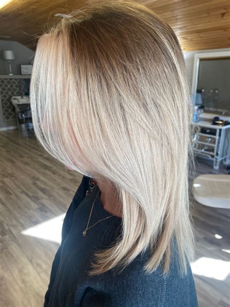 Ash Brown Root Smudge With Balayage Highlights In A Buttery Blonde