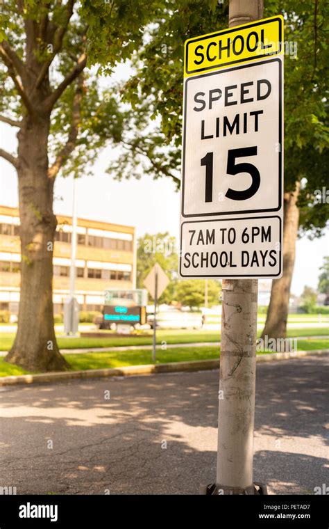 Sign Indicating School Zone Speed Limit Of 15 Miles Per Hour With