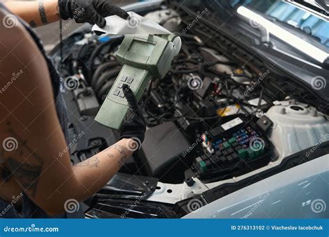 Auto Repairman Uses A Special Scanner In His Work Stock Photo Image