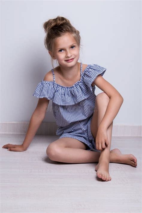 Beautiful Little Fashion Model On White Background Portrait Of Cute