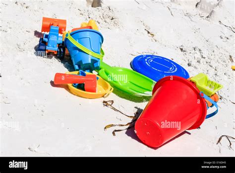 Buckets And Spades The Building Instruments Of Sandcastles Stock Photo