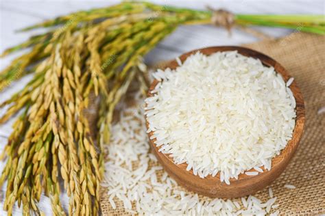 Premium Photo Raw Jasmine Rice Grain With Ear Of Paddy Agricultural