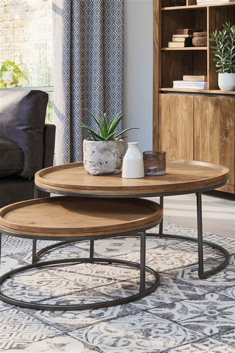 The lower table features rich textured walnut paper, while the smaller floating table boasts an elegant white carrara faux marble top. Next Amsterdam Nest Of 2 Coffee Tables - Natural | Coffee ...