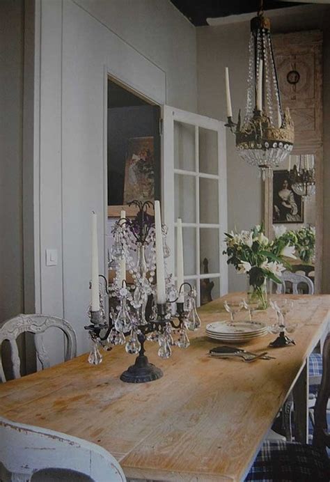 Big Rustic Farmhouse Table With A Chandelier Over It