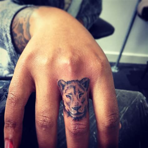 Small Lioness Finger Tattoo Trenchart Amsterdam Artist Quotetattz
