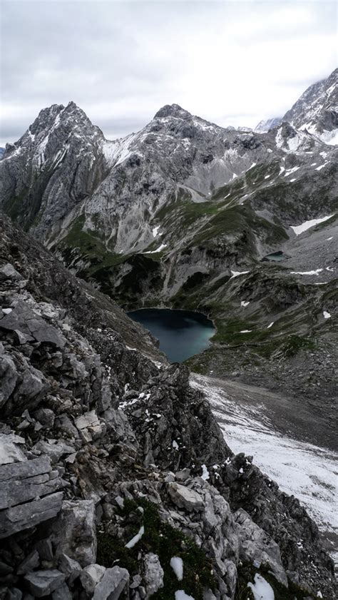 Free Photo Vertical Shot Of A Lake Surrounded By Mountains Under A