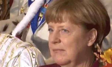 Find the newest angela merkel meme. Angela Merkel's Gesichtsausdruck zur Faschingszeit gif'd
